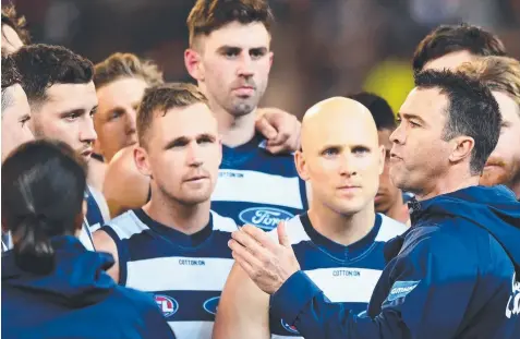  ?? Picture: GETTY IMAGES ?? TOUGH NIGHT: Chris Scott speaks to his players during Friday night’s final against Melbourne.