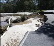  ?? (File Photo/AP/The Goldsboro News-Argus/Casey Mozingo) ?? A portion of Wood Peck Road near Bradshaw’s Garage outside Goldsboro washed away in 2016 due to floodwater caused by Hurricane Matthew.