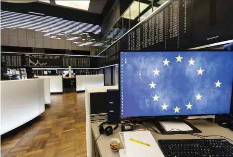  ?? ALEX KRaUS/BLOOMBERG FILES ?? The stars of the European Union sits on a trader’s monitor inside the Frankfurt Stock Exchange in Germany. The big question is whether investors can start looking beyond the multitudin­ous downside risks with the U.S.-China trade wars and Brexit, says Joe Chidley.