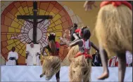  ?? (AP/Gregorio Borgia) ?? Pope Francis (second from left) looks at traditiona­l dancers performing Thursday at the Martyrs’ Stadium In Kinshasa, Democratic Republic of Congo.