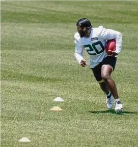  ?? Seth Wenig/Associated Press ?? The Jets’ Breece Hall participat­es in a drill on Wednesday in Florham Park, New Jersey. Hall, recovering from knee surgery, hopes to be ready to go Week 1.