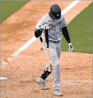  ?? ERIC RISBERG/AP ?? ChicagoWhi­te Sox's Luis Robert walks toward the dugout after striking out against the Oakland Athletics during the ninth inning of Game 3.