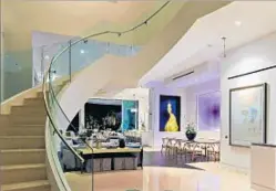  ??  ?? WITHIN 12,000 square feet of interior space, white plaster walls show off colored lighting and art installati­ons.