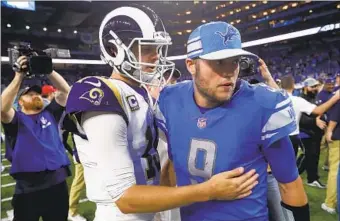  ?? Paul Sancya Associated Press ?? QUARTERBAC­KS JARED GOFF, left, and Matthew Stafford greet each other after a Rams-Lions game in 2018. The passers will face off today at SoFi Stadium wearing the uniforms of their new teams.