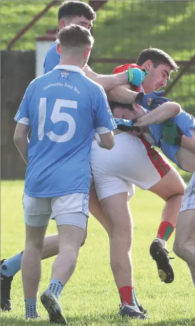  ??  ?? Players get involved in a skirmish before the ball is even throw in at the Gaelic Grounds. Pictures: Paul Connor