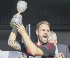  ??  ?? 0 Oban’s Daniel Cameron with the trophy.
PICTURE: NEIL PATERSON