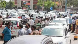  ?? — PTI ?? Heavy traffic jam near a drive-through Covid-19 vaccinatio­n centre at M.G. Road in Gurgaon on Saturday.