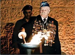  ?? ABIR SULTAN/EPA ?? Holocaust survivor and Red Army veteran Max Pivler lights a torch at Yad Vashem.
