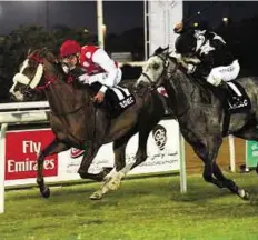  ?? Abdul Rahman/ Gulf News ?? Home stretch Nymphea Du Paon, ridden by James Doyle, heads to victory in the third race at Abu Dhabi Equestrian Club on Sunday.