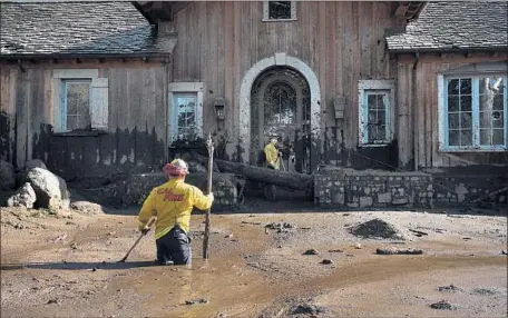  ?? Photograph­s by Wally Skalij Los Angeles Times ?? FIREFIGHTE­R Alex Jimenez marks the location of a possible body under the mud at a house along Glen Oaks Drive in Montecito, Calif.