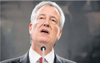  ?? BRENDAN MCDERMID REUTERS ?? New York City Mayor Bill de Blasio speaks to the news media after a New York Police Department (NYPD) disciplina­ry judge recommende­d the firing of officer Daniel Pantaleo, who used a fatal chokehold on unarmed black man Eric Garner during an arrest in 2014, at city hall in New York. August 2. •