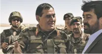  ??  ?? Maj. Gen. M. Moein Faqir, center, a top general in Afghanista­n, was appointed by the country’s president to clean up corruption in Helmand Province. He has been arrested on sweeping corruption charges after little more than a year on the job, senior...