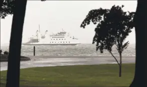  ?? Christian Abraham / Hearst Connecticu­t Media ?? The Port Jefferson ferry makes its way through choppy water in Long Island Sound near Bridgeport on Friday. A rare tropical storm named Fay started Friday evening hitting the area with winds from 35-45 mph and gusts up to 50 mph.