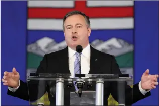  ?? CP PHOTO DAVE CHIDLEY ?? Premier Jason Kenney speaks in response to the results of the United Conservati­ve Party leadership review in Calgary on Wednesday. Kenney stepped down as leader of the party but it was decided Thursday he would remain premier until a new leader is chosen.