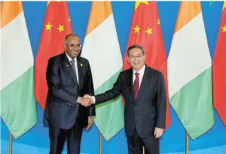  ?? Picture: CNSPHOTO VIA STRINGER ?? GLOBAL FORUM: Chinese Premier Li Qiang meets Ivory Coast Prime Minister Patrick Achi at the four-day Boao Forum for Asia Annual Conference in Boao, Hainan province, China, that ends today