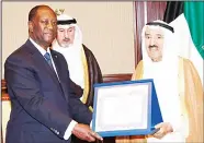  ?? KUNA photo ?? His Highness the Amir Sheikh Sabah Al-Ahmad Al-Jaber Al-Sabah received Tuesday at Bayan Palace Cote d’Ivoire’s President Alassane Ouattara, as both leaders presided over discussion­s.
His Highness the Amir was joined by Kuwaiti Prime Minister His...