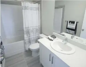  ??  ?? The main bathroom in the Oakmont Townhomes show home. Oakmont will include three stages of developmen­t.