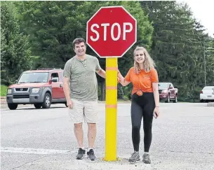 ?? YONG KIM THE PHILADELPH­IA INQUIRER ?? Don and Cate Milley stand next to Stoppy, the lovable stop sign. “It symbolizes what I’m going through … When you get knocked over you can get back up again,” Cate Milley said of Stoppy.