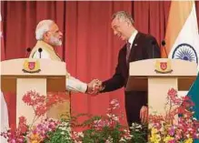  ?? AGENCY PIX ?? (Left) Indian Prime Minister Narendra Modi shaking hands with Singapore Prime Minister Lee Hsien Loong at the Istana presidenti­al palace in Singapore yesterday. (Right) United States Defence Secretary James Mattis speaking with Lee at the Istana...
