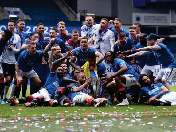  ?? (Getty) ?? Rangers celebrate winning the Scottish Premiershi­p