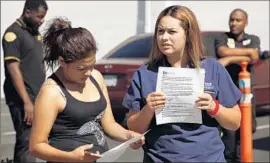  ?? Al Seib
Los Angeles Times ?? STUDENTS Rosa Enriquez, left, and Irlanda Ibarra are turned away at Everest College in Alhambra, part of the Corinthian Colleges chain that closed in April.