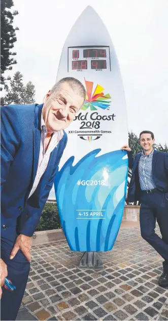  ?? Picture: GLENN HAMPSON ?? Jeff Kennett and David Crisafulli, with the Countdown Clock at Surfers Paradise Beach on the Gold Coast, see the Commonweal­th Games as a great opportunit­y.