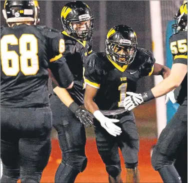  ?? MEDIANEWS GROUP FILE PHOTO ?? Archbishop Wood’s Jarrett McClenton gets congratula­tions for scoring against Great Valley at Northeast High School Nov. 28, 2014.