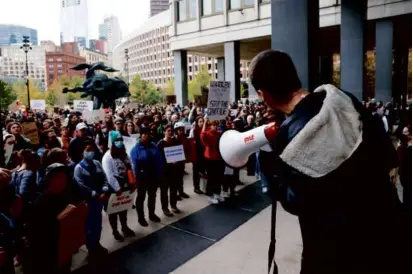  ?? JESSICA RINALDI/GLOBE STAFF ?? Above, a pro-Palestinia­n rally organized by Jewish groups outside the John F. Kennedy Federal Building in Boston Wednesday.