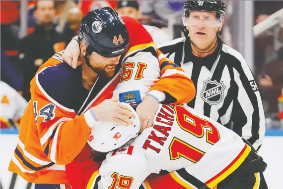  ?? PERRY NELSON- ?? Oilers winger Zack Kassian mixes it up with Flames winger Matthew Tkachuk Wednesday, during Battle of Alberta action at Rogers Place.