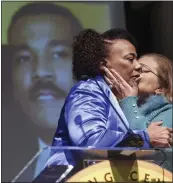  ?? JOHN BAZEMORE — THE ASSOCIATED PRESS ?? Bernice King, daughter of civil rights leader Martin Luther King Jr., left, gets a kiss from Alveda King a she speaks about her brother Dexter Scott King during a news conference Tuesday in Atlanta.
