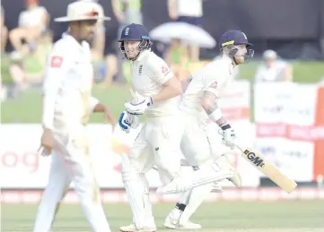  ?? — AFP photo ?? England's Jonny Bairstow (C) and Ben Stokes (R) run between the wickets during the first day of the third Test match between Sri Lanka and England at the Sinhalese Sports Club (SSC) internatio­nal cricket stadium in Colombo on November 23, 2018.