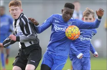  ??  ?? Jack Crawford, Quay celtic is challenged by Itsily Egaghe, Glenmuir.