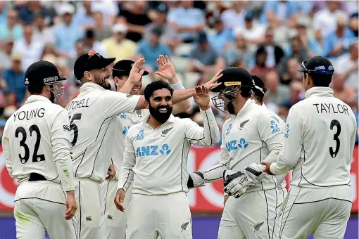  ?? AP ?? Left-arm spinner Ajaz Patel and his Black Caps team-mates celebrate the dismissal of England’s Ollie Pope in the second test at Edgbaston.