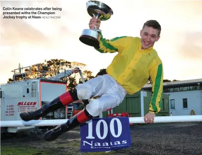  ?? HEALY RACING ?? Colin Keane celebrates after being presented withe the Champion Jockey trophy at Naas