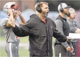  ?? STEVE RUARK/BALTIMORE SUN MEDIA GROUP ?? Glenelg coach Butch Schaffer has led his team to 13 straight victories this season and a berth in its first state championsh­ip game on Saturday night.