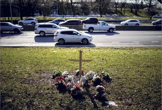  ?? Stephen Speranza / The New York Times ?? A makeshift memorial marks the site of a fatal accident along the Belt Parkway just beyond the 150th street overpass in Queens. In New York City, at least 243 people died in crashes in 2020 — the most since Mayor Bill de Blasio introduced his signature street safety plan in 2014.