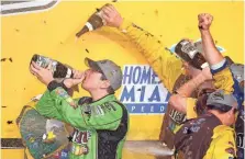  ?? JASEN VINLOVE, USA TODAY SPORTS ?? Kyle Busch, left, celebrates after winning the 2015 NASCAR Sprint Cup championsh­ip.