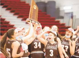  ?? MATT WOOLVERTON/BU ATHLETICS ?? Lehigh women’s basketball players celebrate their fourth Patriot League championsh­ip after a 64-54 win Sunday at Boston University.