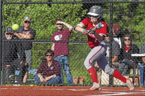  ?? JEN FORBUS — THE MORNING JOURNAL ?? Elyria’s Macy Taylor lays down a bunt in the Lorain County All-Star game on June 4.