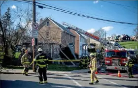  ?? Alexandra Wimley/Post-Gazette ?? DORMONT FIRE Firefighte­rs work the scene of a house fire in the 1000 block of Kelton Avenue in Dormont on Sunday.