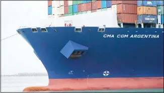  ??  ?? Crew members stand on the bow as the CMA CGM Argentina arrives at PortMiami, the largest container ship to call at a Florida port, Tuesday, April 6, 2021, in Miami. The US trade deficit grew to $71.1 billion in February, as a decline in exports more than offset a slight dip in imports.
The February gap between what America buys from abroad compared to what it sells abroad jumped 4.8% the revised January deficit of $67.8 billion. The increase reflected a 2.6% decline in exports of goods and services to $187.3 billion on a seasonally adjusted basis. (AP)