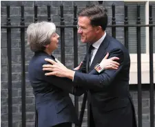  ?? Photo: PA ?? British Prime Minister Theresa May greets the Dutch PM Mark Rutte outside 10 Downing Street yesterday.