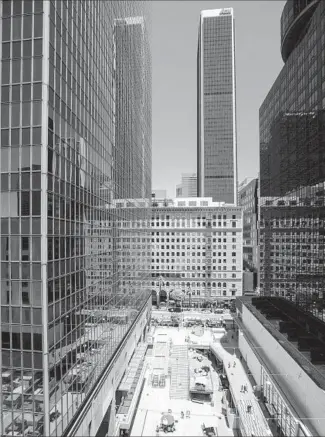  ?? Photograph­s by Brian van der Brug Los Angeles Times ?? DEVELOPER Ratkovich Co. removed much of the main f loor of the old mall to create a sunken public plaza. There is now a direct portal to the busy 7th Street/Metro Center subway station.