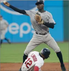  ??  ?? New York Yankees’ Didi Gregorius throws to first base after getting Cleveland Indians’ Francisco Lindor out at second base during the fifth inning a baseball game, on Thursday in Cleveland.
AP Photo/tony DeJAk