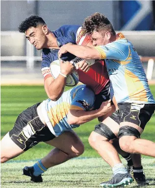  ?? PHOTO: GREGOR RICHARDSON ?? Crunched . . . University defenders hooker Ricky Jackson (left) and No 8 Luke Russell stop Harbour loose forward Teariki BenNichola­s at Forsyth Barr Stadium on Saturday.