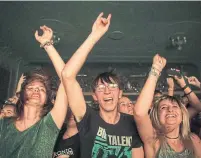  ??  ?? Fans join in with Billy Talent at the Danforth Music Hall on Saturday as part of a benefit concert for the Danforth victims.