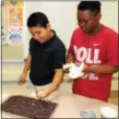  ?? DIGITAL FIRST MEDIA FILE PHOTO ?? Students made a healthy snack out of celery and raisins during a family Wellness Night at Barth Elementary School in Pottstown. Eating healthy and nutritious foods can lead to a more positive mood.