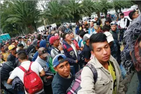  ?? AP PHOTO BY ANTHONY VAZQUEZ ?? Central American migrants who splintered off a U.s.-bound caravan, file into a sporting center that has been turned into a shelter for them in Mexico City, Sunday, Nov. 4, 2018. The migrants now aim to regroup in the Mexican capital, seeking medical care and rest while they await stragglers.