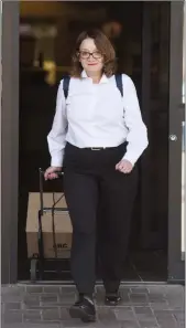  ??  ?? Crown prosecutor Photini Papadatou leaves the Lethbridge Court House following the first day of the Derek Saretzky trial in Lethbridge on Wednesday. @TMartinHer­ald