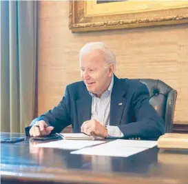  ?? ADAM SCHULTZ/THE WHITE HOUSE ?? President Joe Biden speaks by phone Thursday in the White House to Sen. Bob Casey, D-Pa.